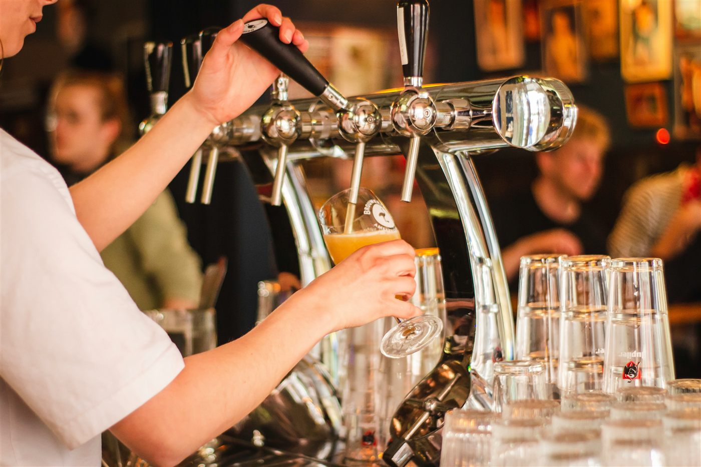 Craft beer being poured in a bar
